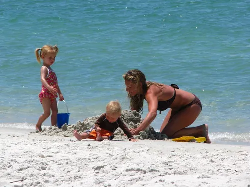 Family enjoying a sunny beach vacation together